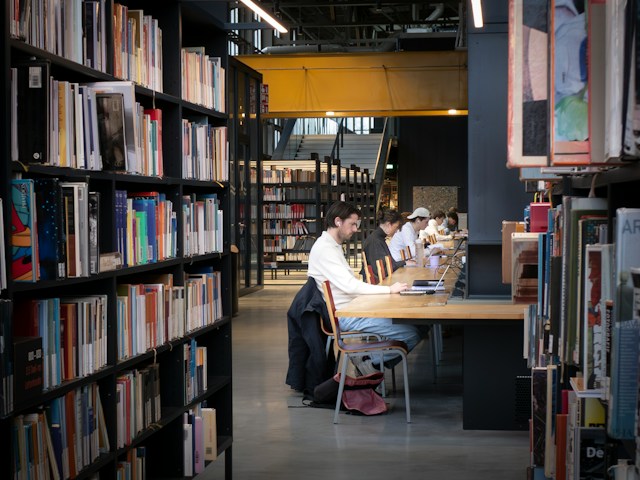 Students studying in college library